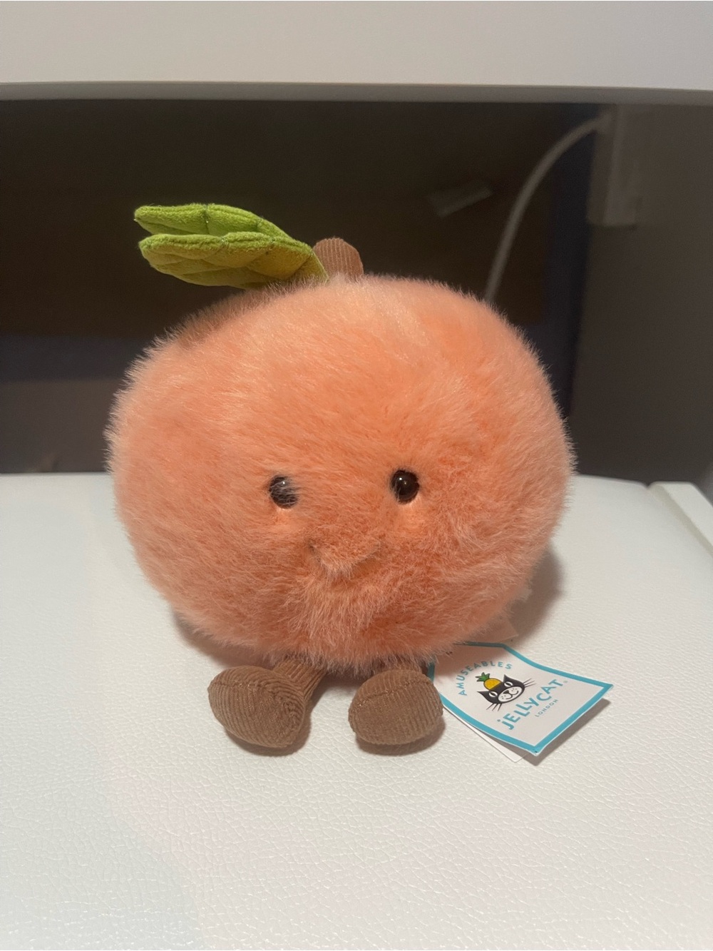 Jellycat Peach Plush Toy in Soft Orange with Green Leaf